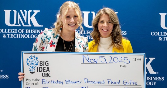 UNK senior Fallon Wells, left, is pictured with Center for Entrepreneurship and Rural Development Director Sara Bennett after winning the Big Idea business pitch competition in November. A Startup Studio participant, Wells plans to return to her hometown of Central City to run the local flower shop after graduation. (Photo by Ryo Suzuki, UNK College of Business and Technology)