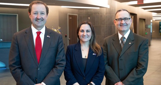 From left, Chris Kratochvil, MD, vice chancellor of external relations for UNMC, Lauren Sauer, PhD, associate professor in the UNMC College of Public Health and associate director of research at the Global Center for Health Security, and Col. Lee Williames (USAF, Ret.), MD, inaugural director of the Office for the Advancement of Military Medicine. (Rich Watson/UNMC)   