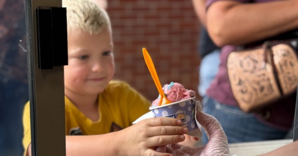 Elijah Wachter of Ravenna receives Scoops ice cream